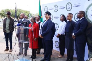 The Chairperson of the TRC Cases Inquiry Justice Sisi Khampepe, Commissioners Andrea Gabriel SC, retired Judge President Frans Kgomo, Secretary Adv Mamokete Thokoa and members of the Legal team at the Hector Petersen Memorial in Soweto for the first media briefing of the Inquiry, 19 August 2025.